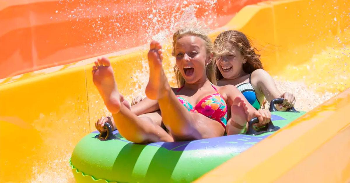 Two teenagers in green tube