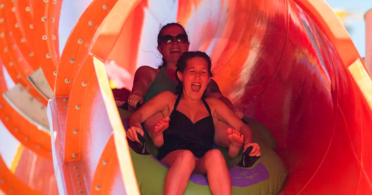 two ladies starting ride in green tube