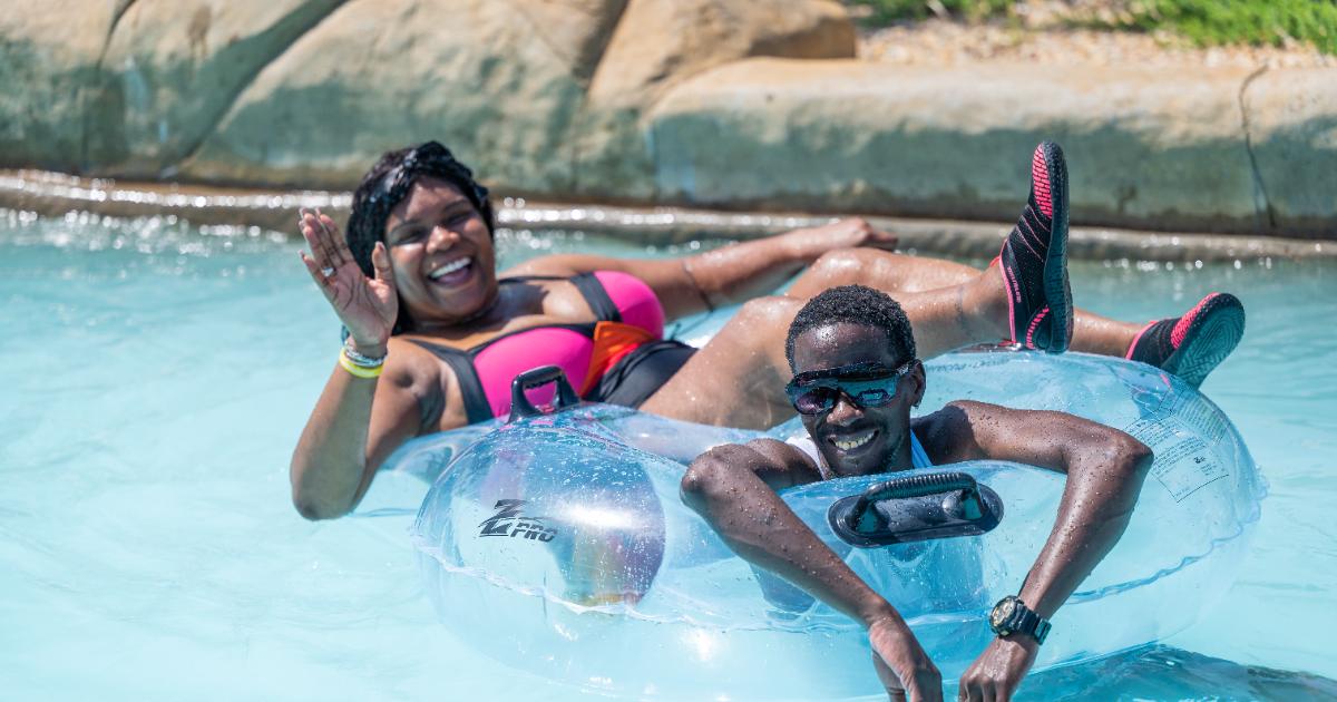 Man and waving woman