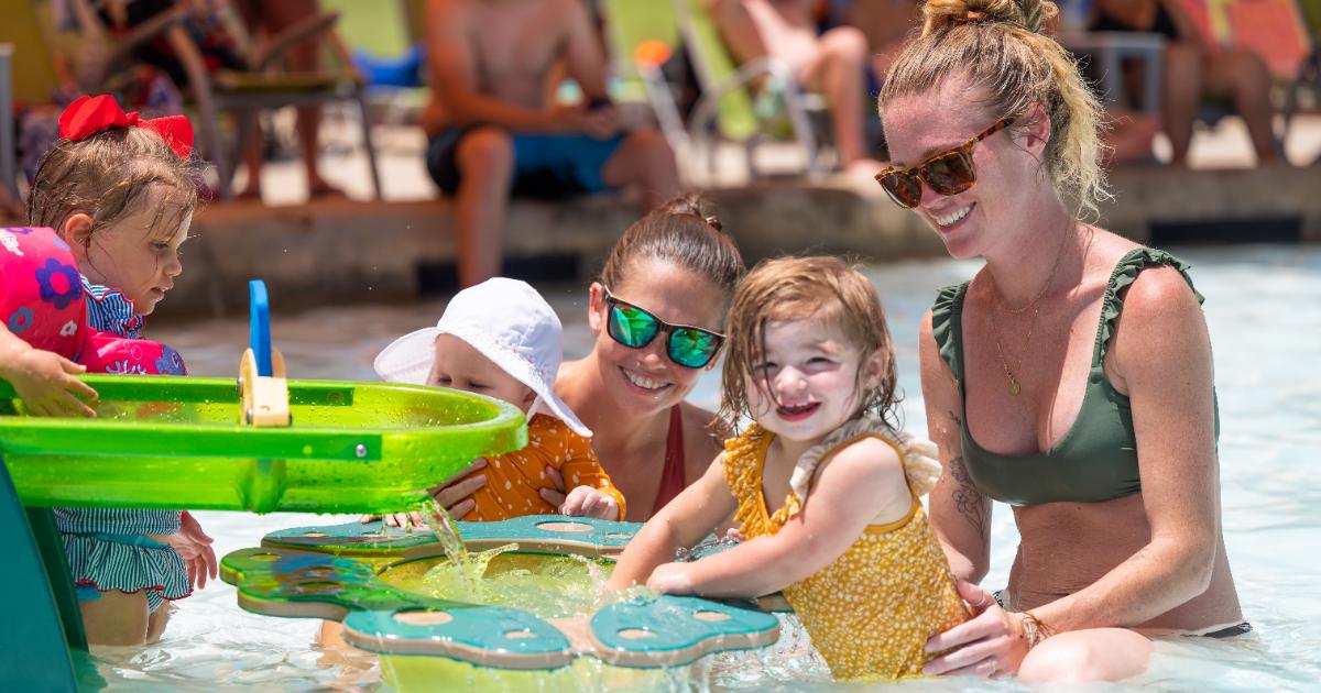 moms and daughters at water structure