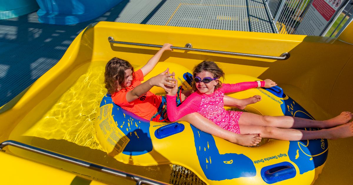 Orange boy giving pink girl high five