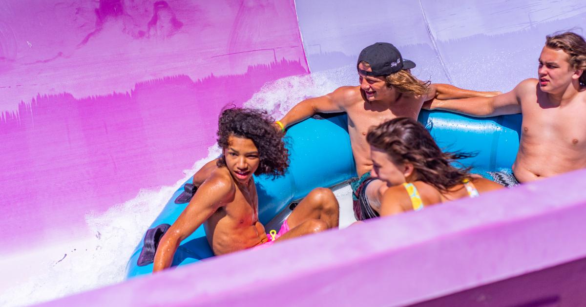 Teenagers on blue tube.