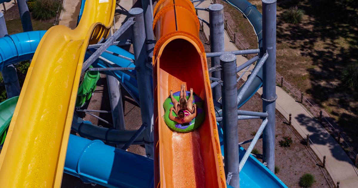 Raft in opening of orange slide