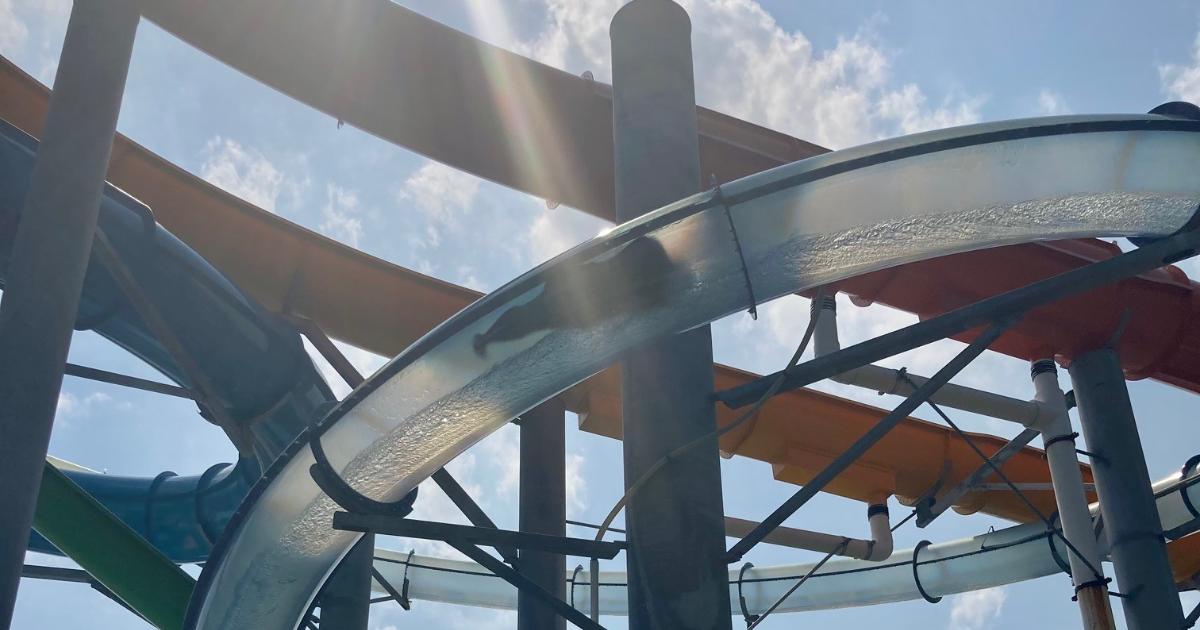 Slide structure and person in clear tube