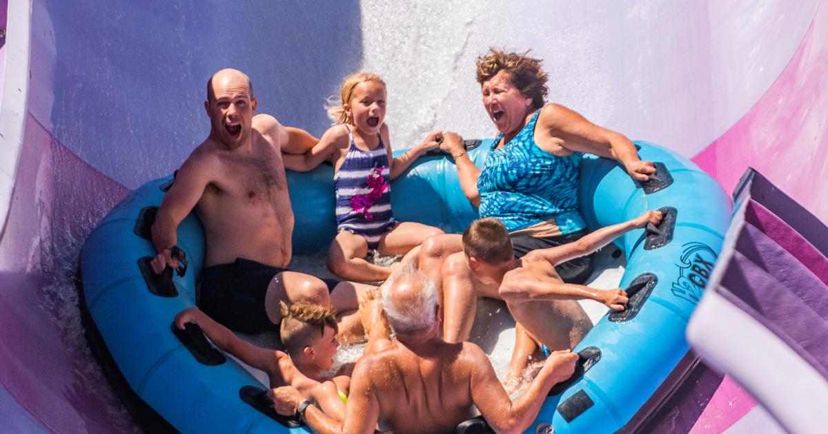 Multi generational family on blue tube