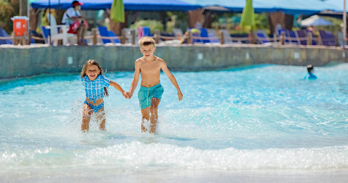 Family running through Twin Tides