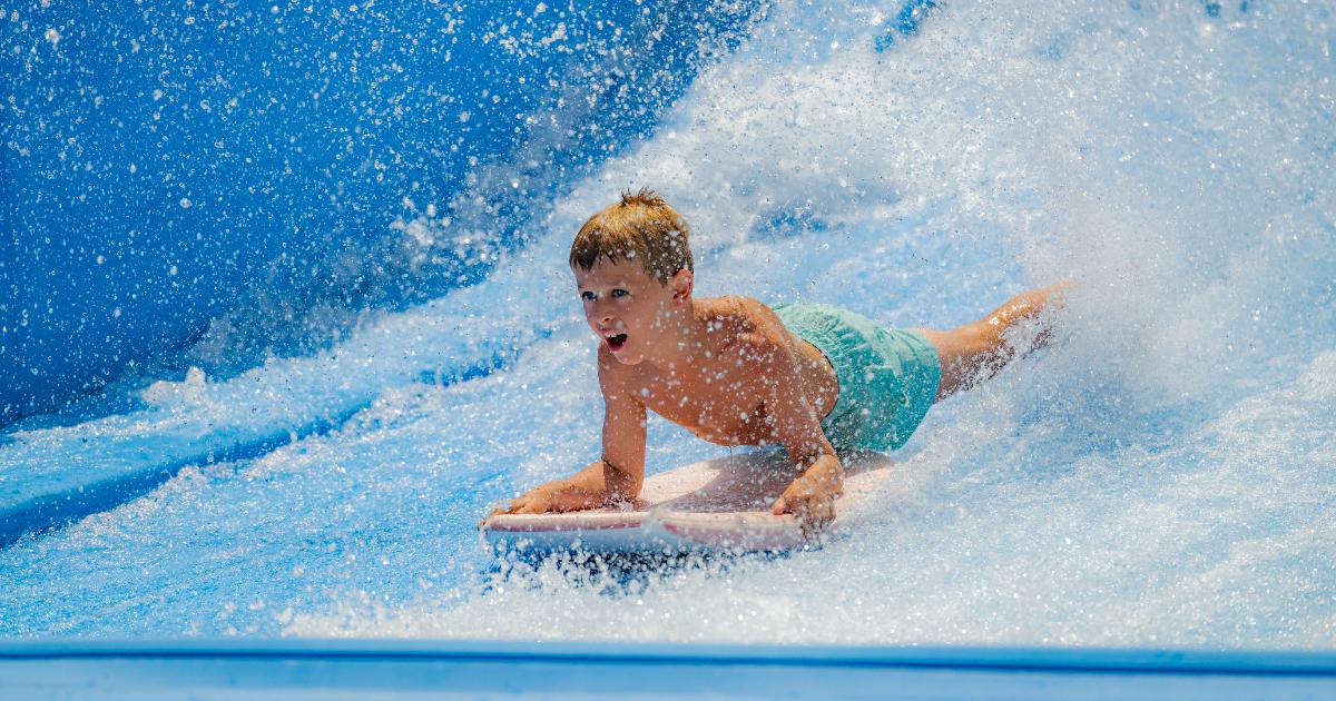 Boy in blue shorts on board