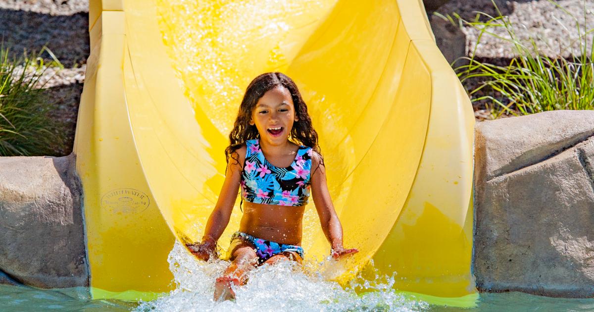 Girl on yellow slide
