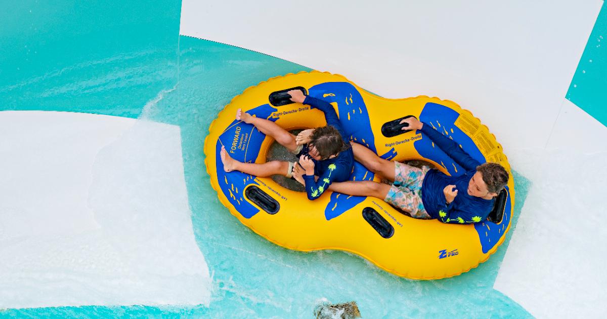 Man splashing at end of slide