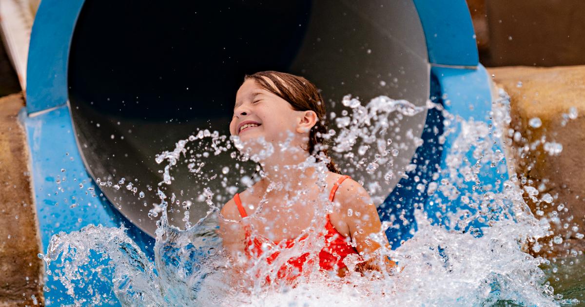 Girl coming out of slide